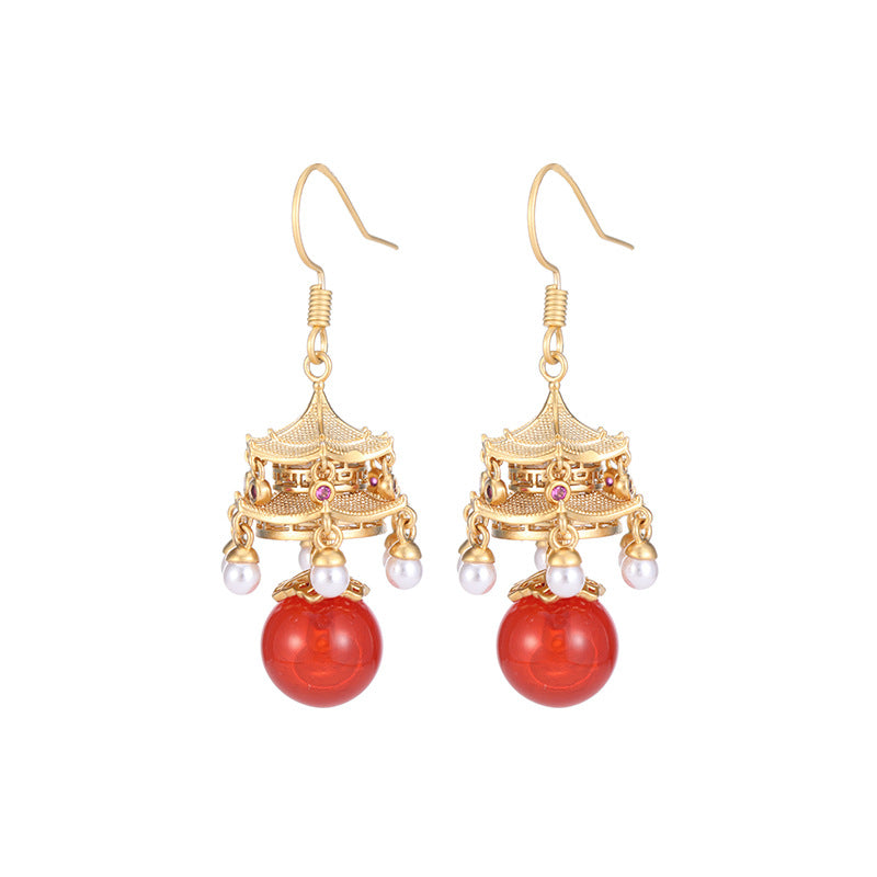 Calm red agate pearl earrings with gold intricate design and dangling pearls