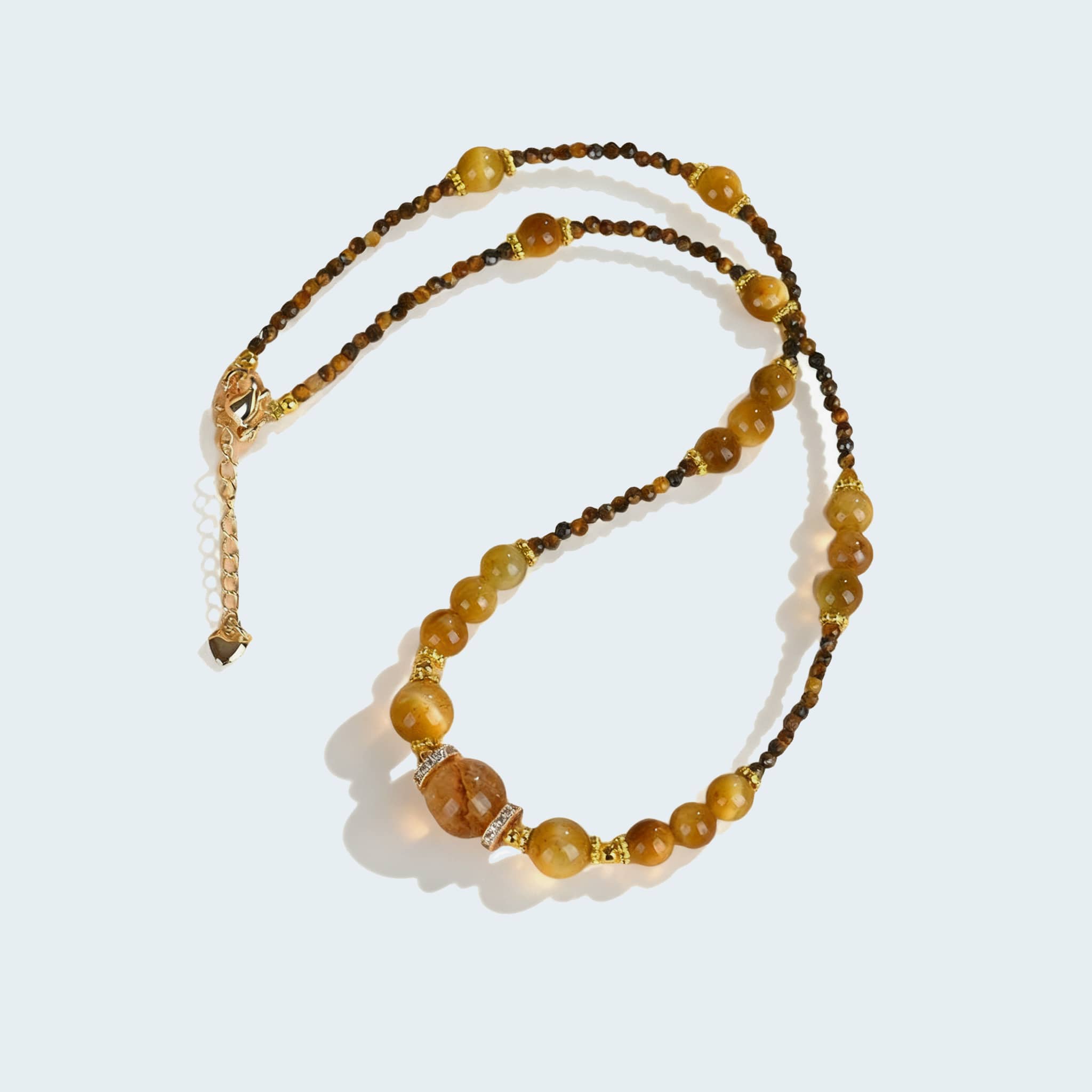 Golden tiger's eye anxiety necklace with natural gemstones for calming energy and stylish wear