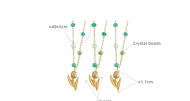 Calm necklace featuring green and clear bead jewelry with gold leaf pendant and crystal beads