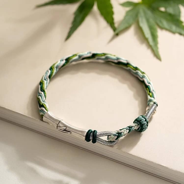 Green cord mindfulness bracelet from 5 Senses featuring a braided design and silver accents