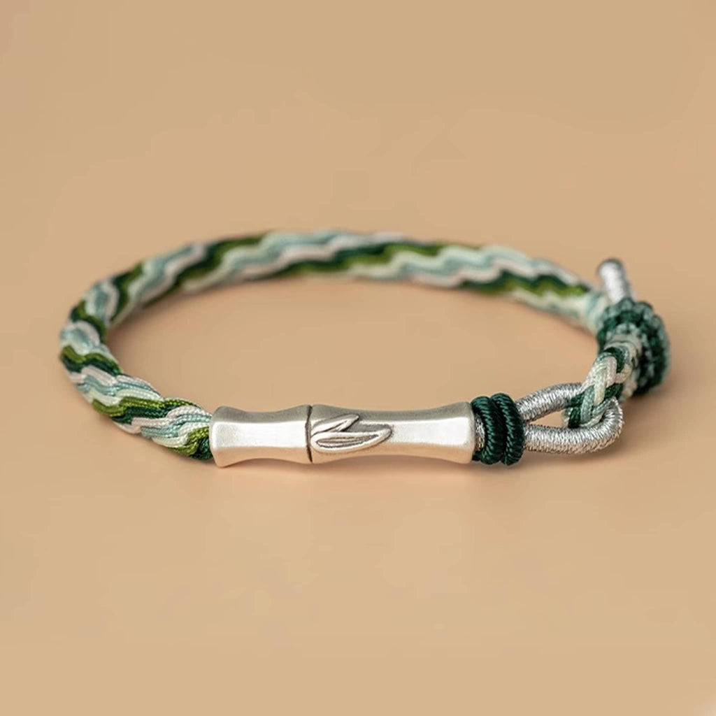 Green cord mindfulness bracelet by 5 Senses featuring a stylish woven design and silver accents