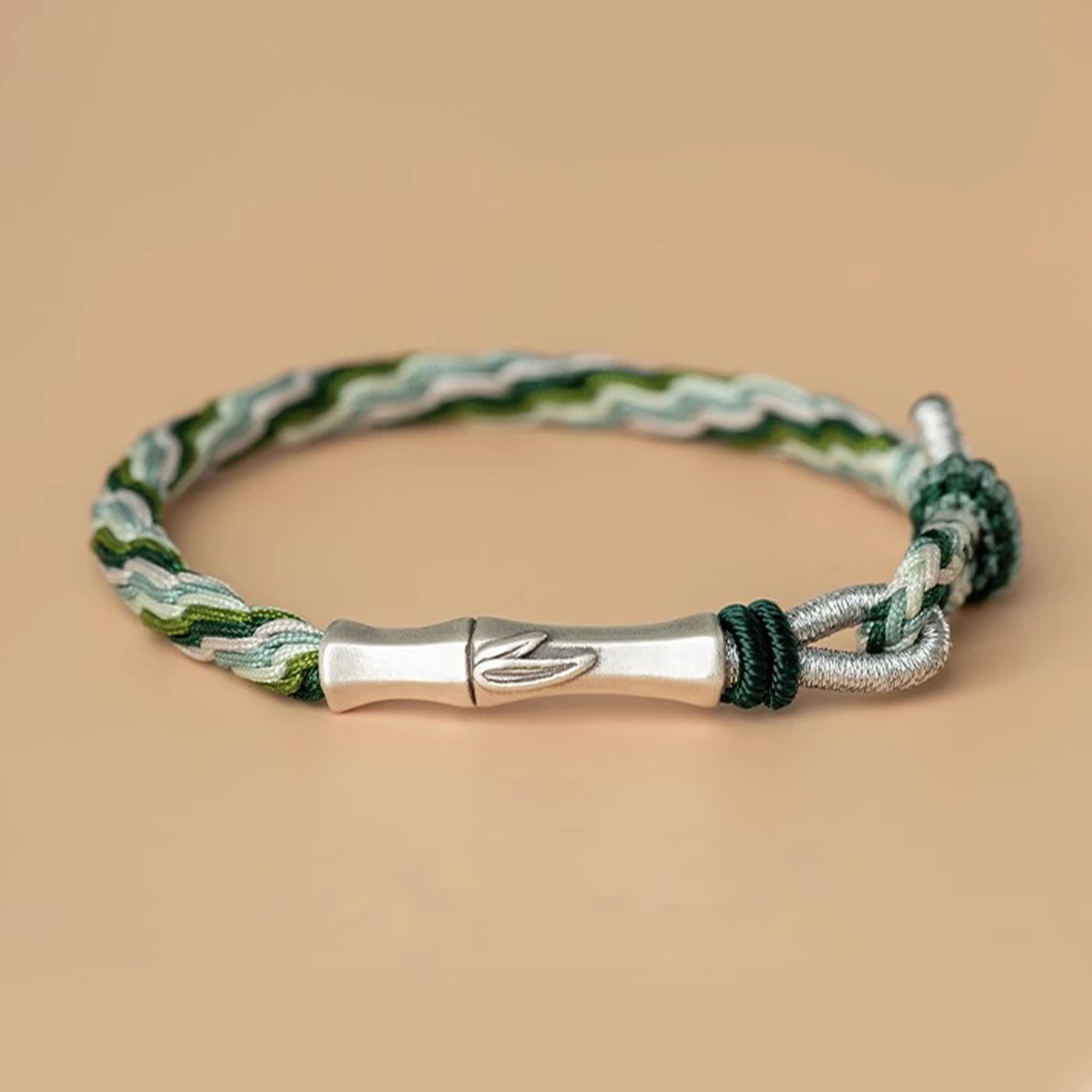 Green cord mindfulness bracelet by 5 Senses featuring a stylish woven design and silver accents