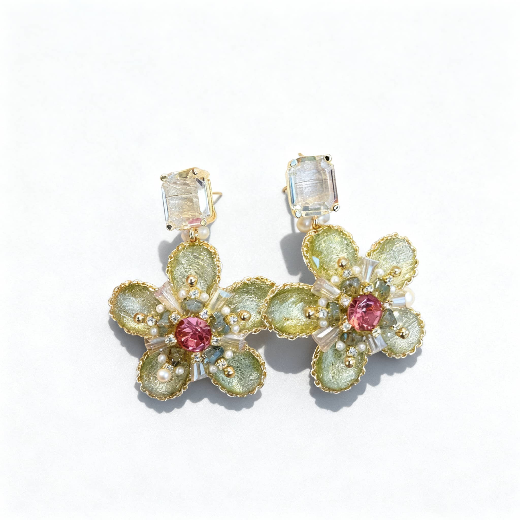 5 Senses green crystal flower stud earrings with intricate bead detailing and a pink center gem