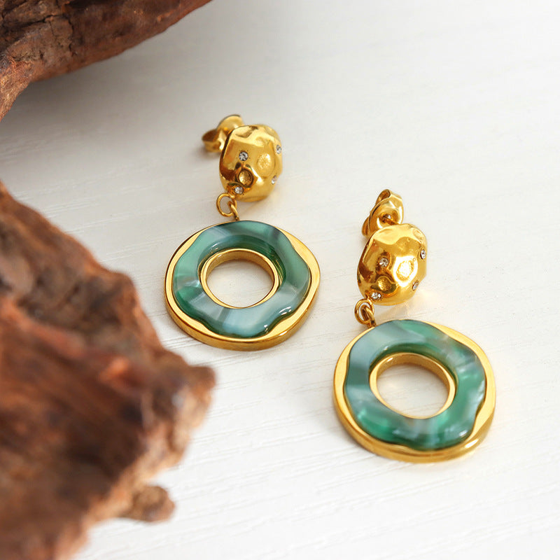 Calm green lake reflection earrings with gold accents and circular green resin design