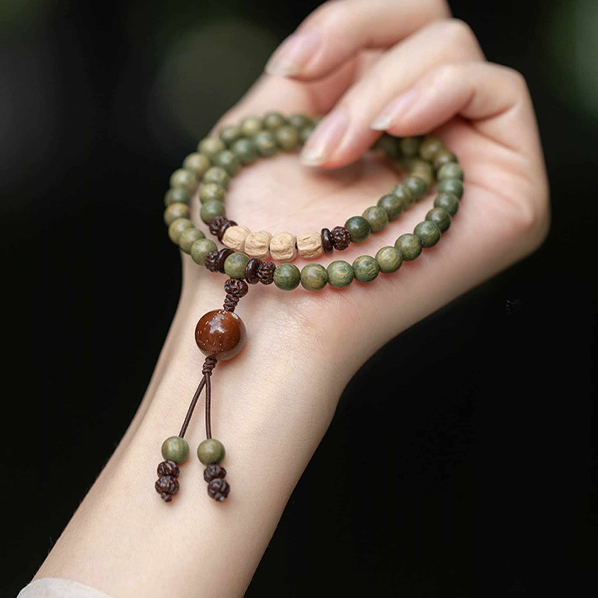 Green sandalwood mala bracelet with wooden beads for mindfulness and meditation practice