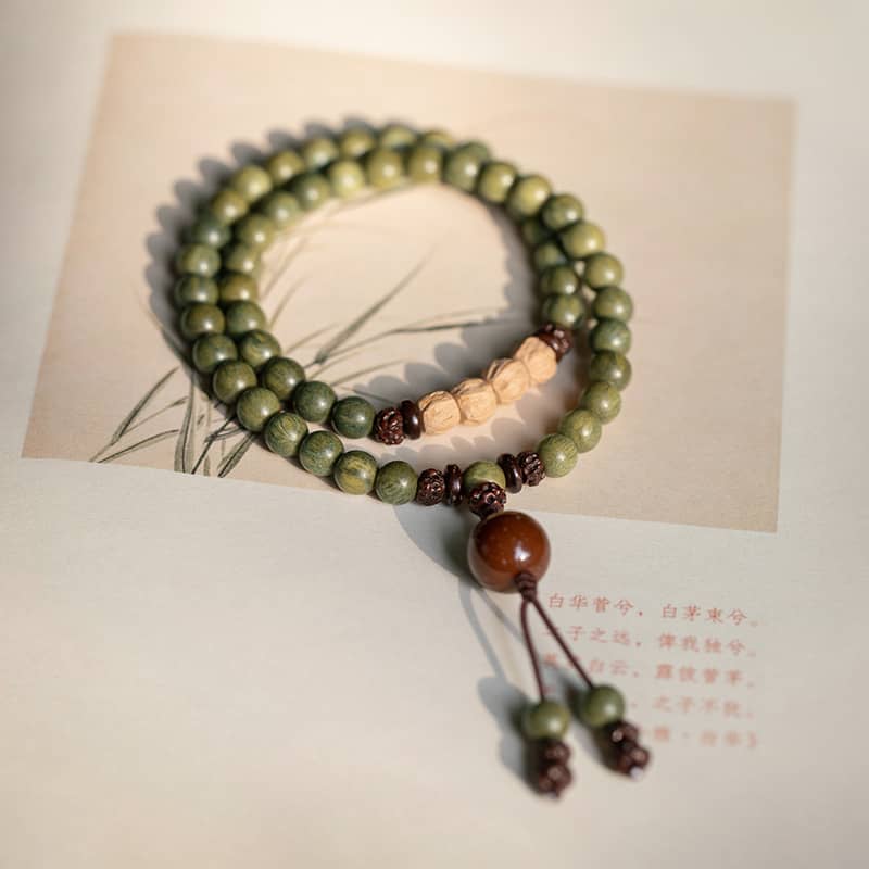 Green sandalwood mala bracelet with natural wooden beads for meditation and mindfulness