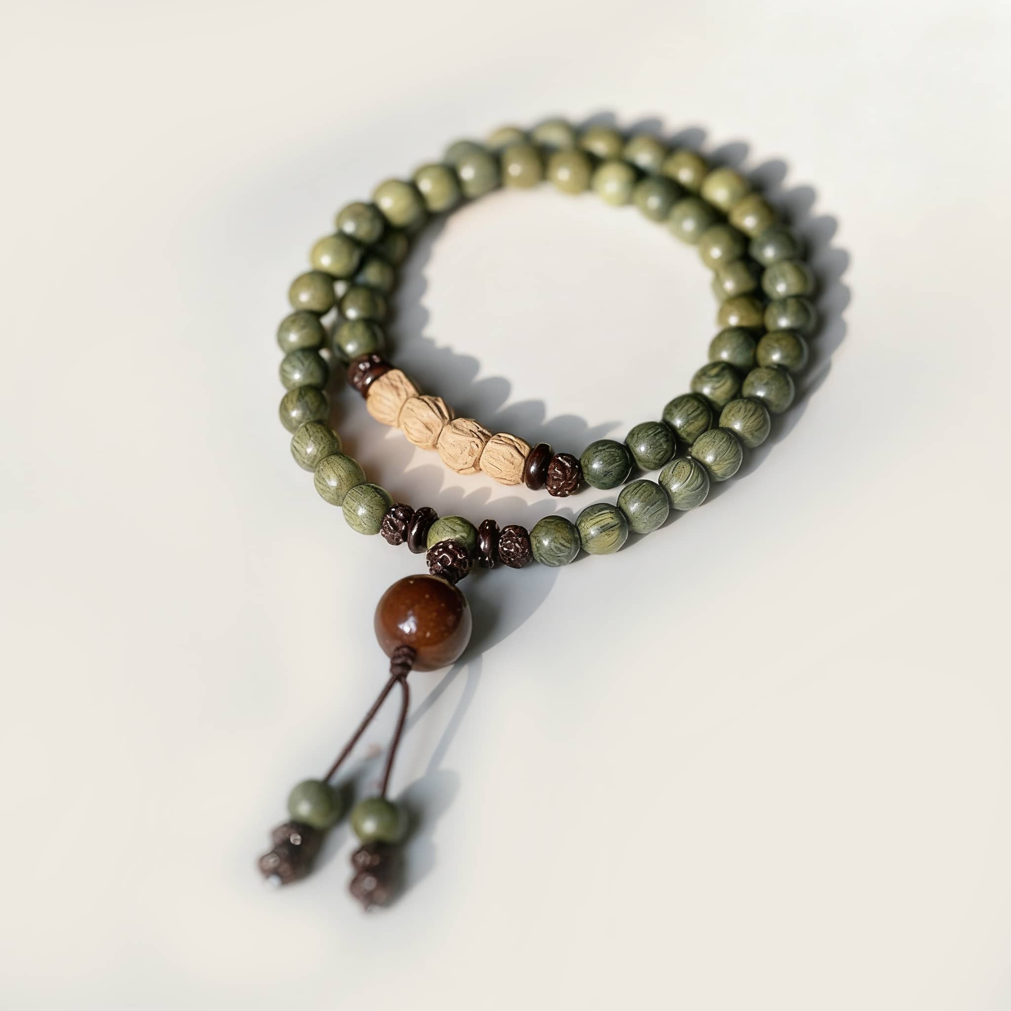 Green sandalwood mala bracelet with beads for meditation and stress relief from 5 Senses