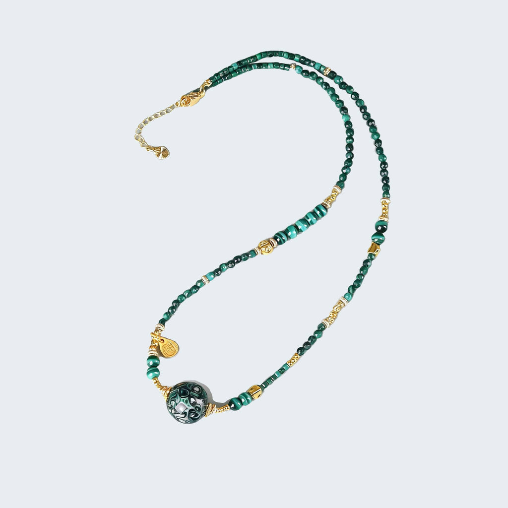 Green Urushi Mindfulness Necklace featuring beads and gold accents for calming elegance