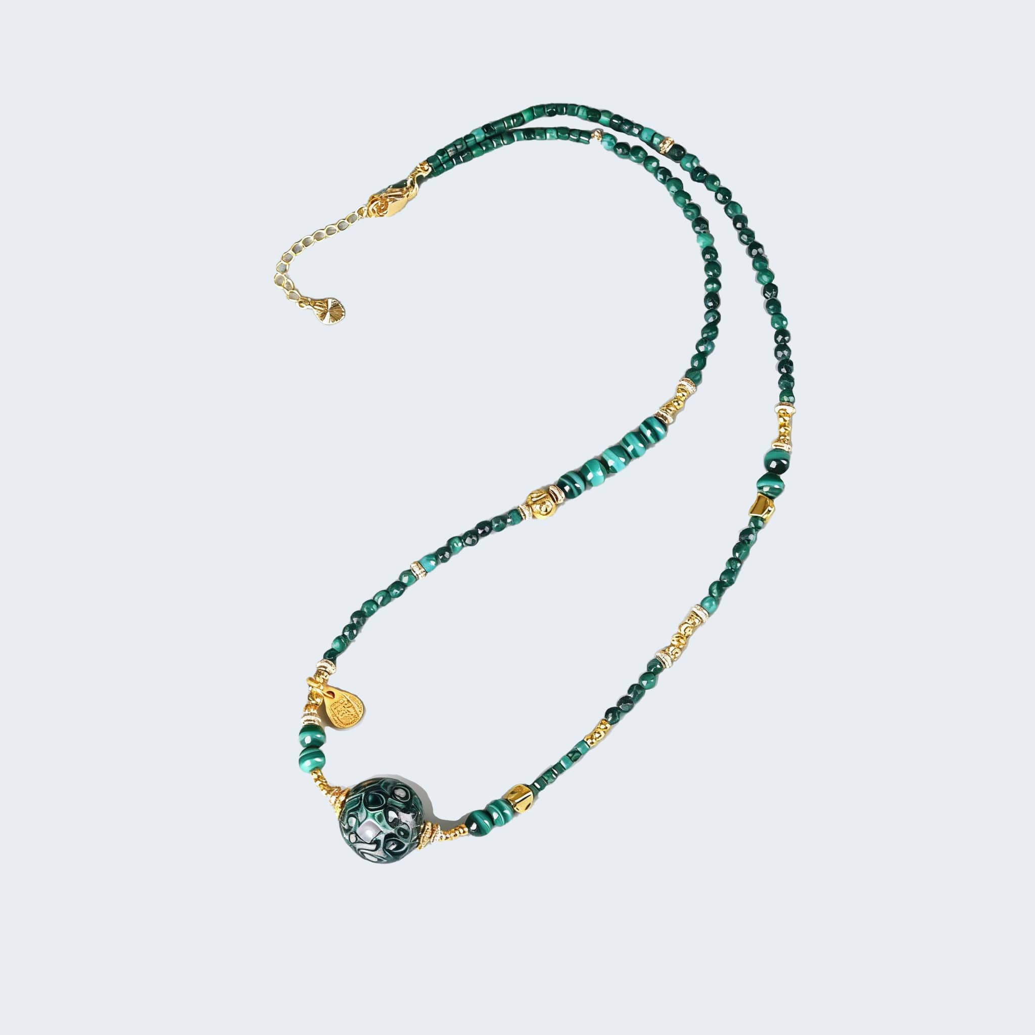 Green Urushi Mindfulness Necklace featuring beads and gold accents for calming elegance