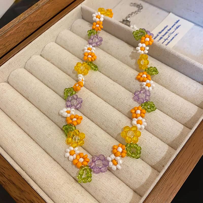 Hand-beaded floral necklace featuring colorful beads in vibrant floral designs