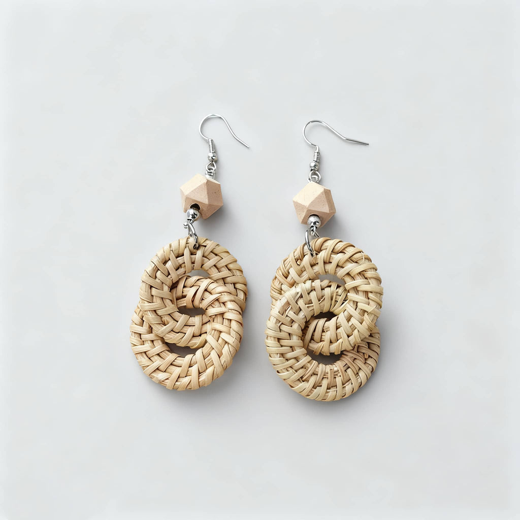 Handmade calming earrings featuring woven natural materials and wooden accents for a serene look