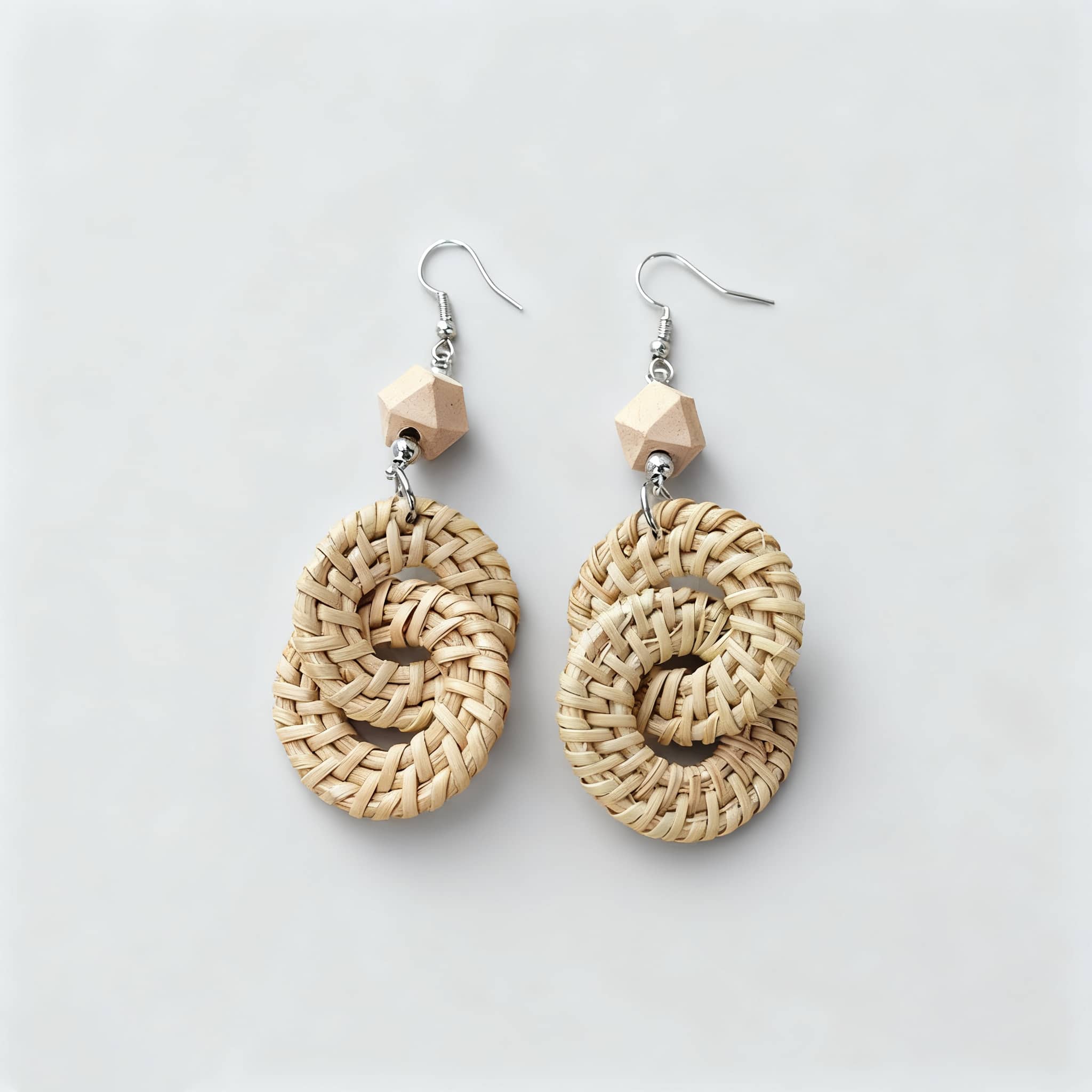Handmade calming earrings featuring woven natural materials and wooden accents for a serene look