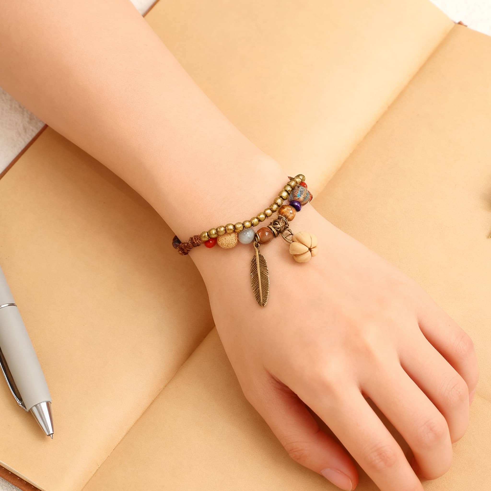 Hawthorn seed ceramic bracelet with colorful beads and charm on a wrist, perfect for stylish accessories