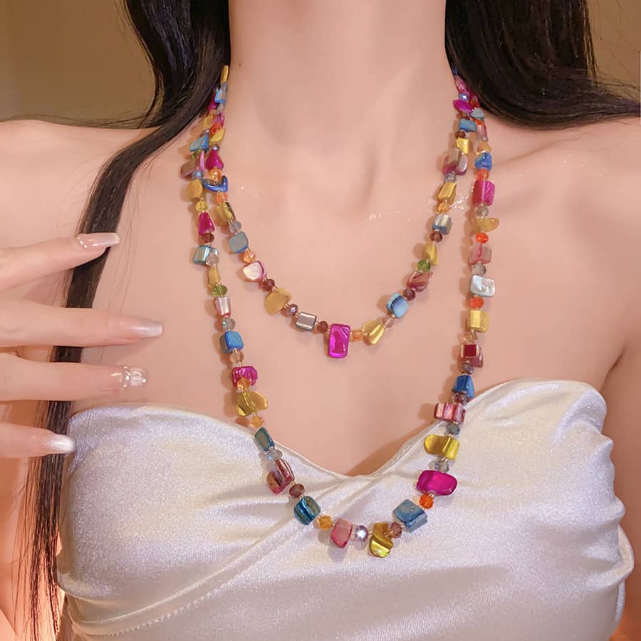 Joy necklace featuring colorful irregular crystal bead necklace in a layered design for a vibrant look