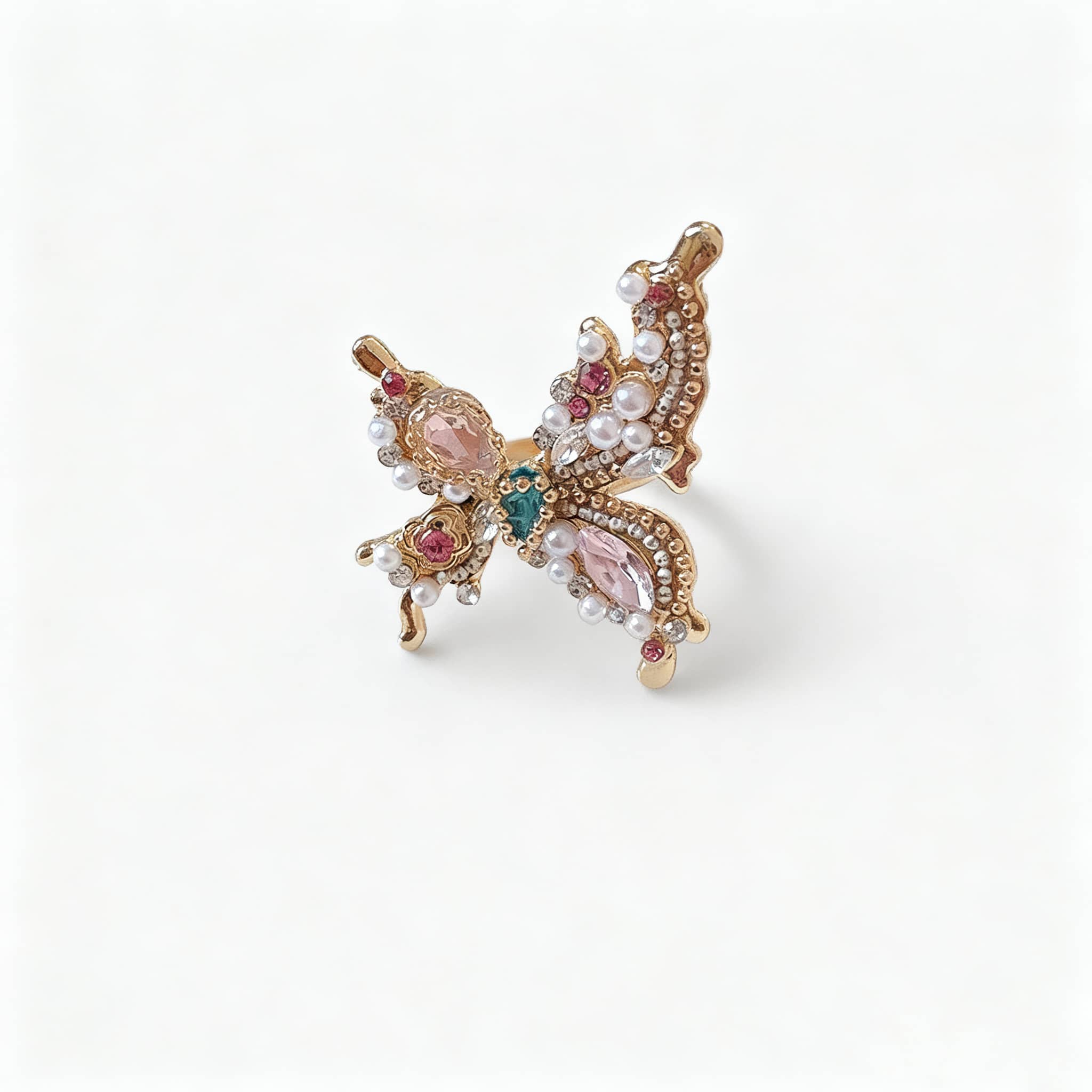 Joyful butterfly statement ring with colorful gemstones and pearl accents in elegant design
