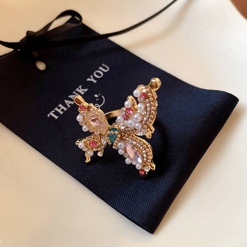 Joyful butterfly statement ring adorned with colorful gems and pearls from 5 Senses