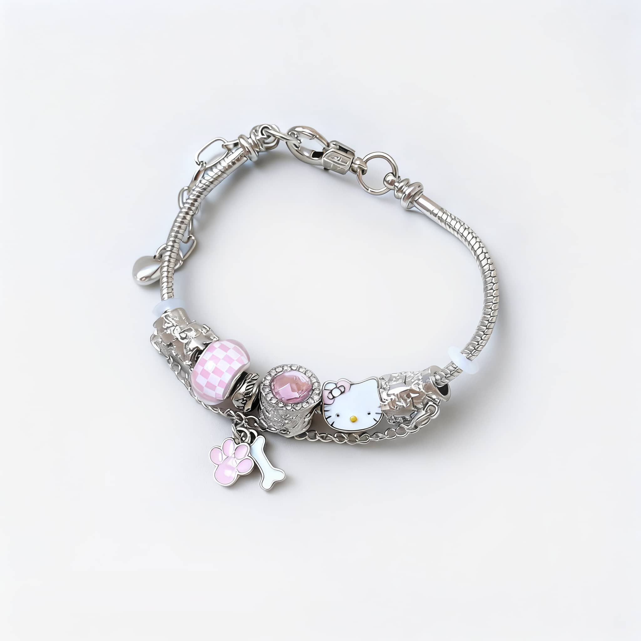 Joyful cat charm bracelet with pink and silver accents featuring Hello Kitty and paw print charms