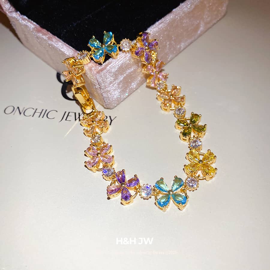 Joyful floral zirconia snap bracelet with colorful flowers and gold accents for stylish elegance