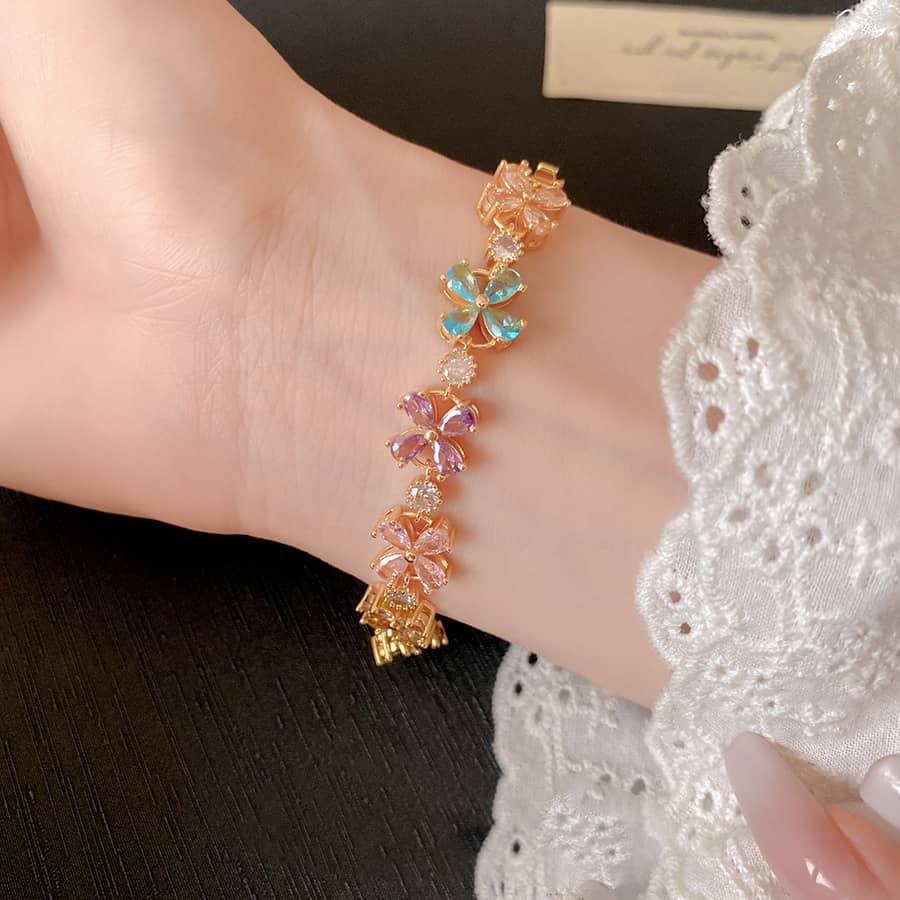 Joyful floral zirconia snap bracelet with colorful flower charms on a delicate gold chain