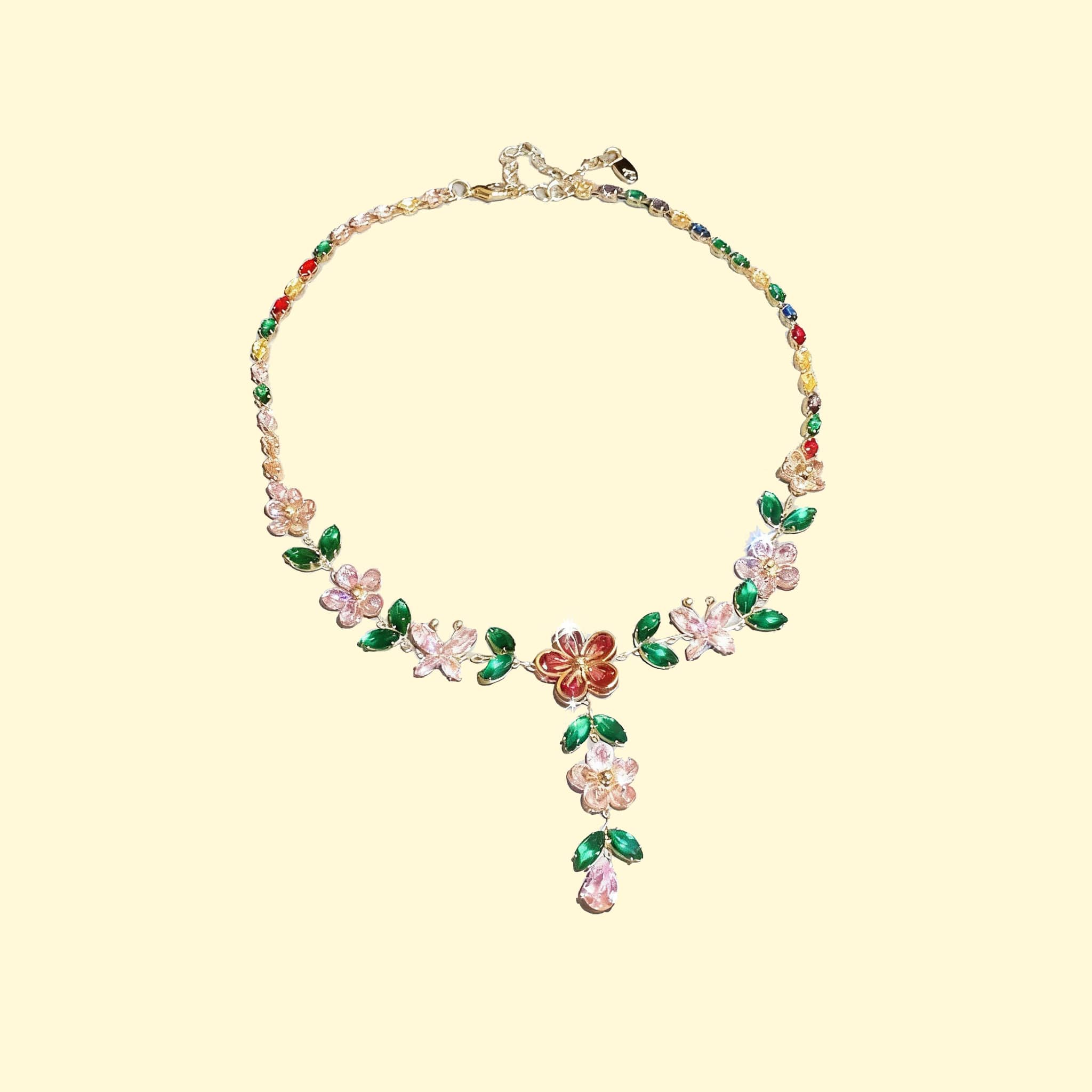Colorful joyful zircon flower necklace with intricate floral design and green leaf accents
