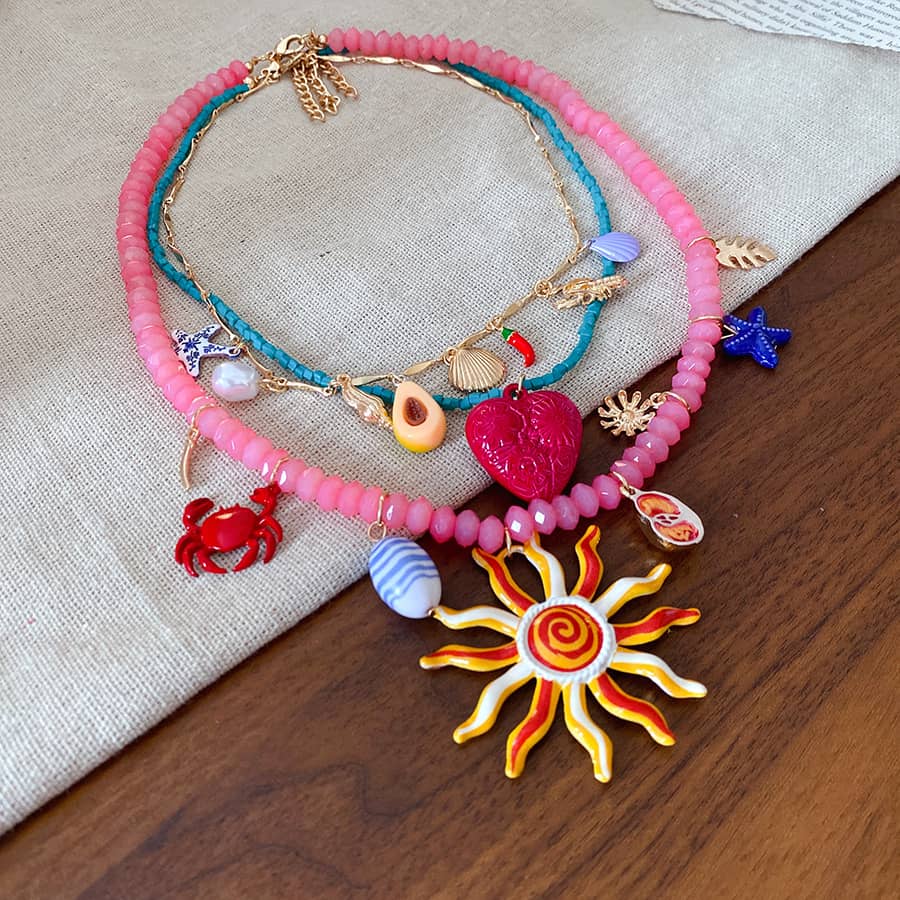 Joy layered resin glass pendant necklace with colorful charms and beads for a playful look