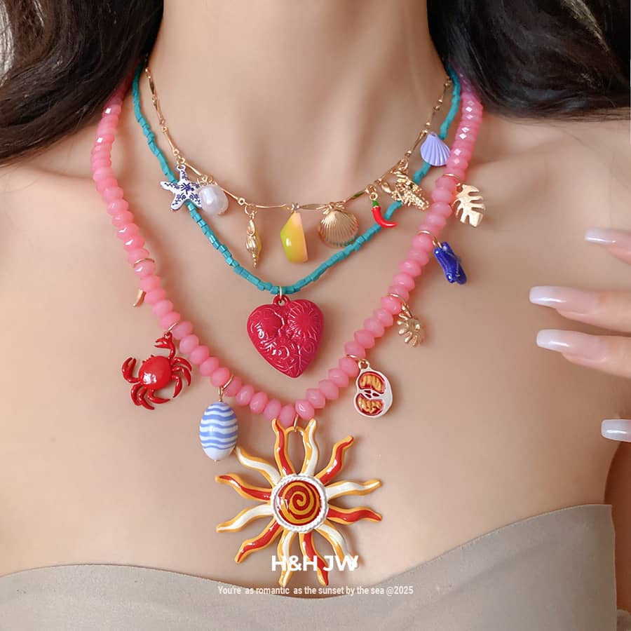 Colorful layered resin glass pendant necklace with charms and beads for a vibrant beachy look