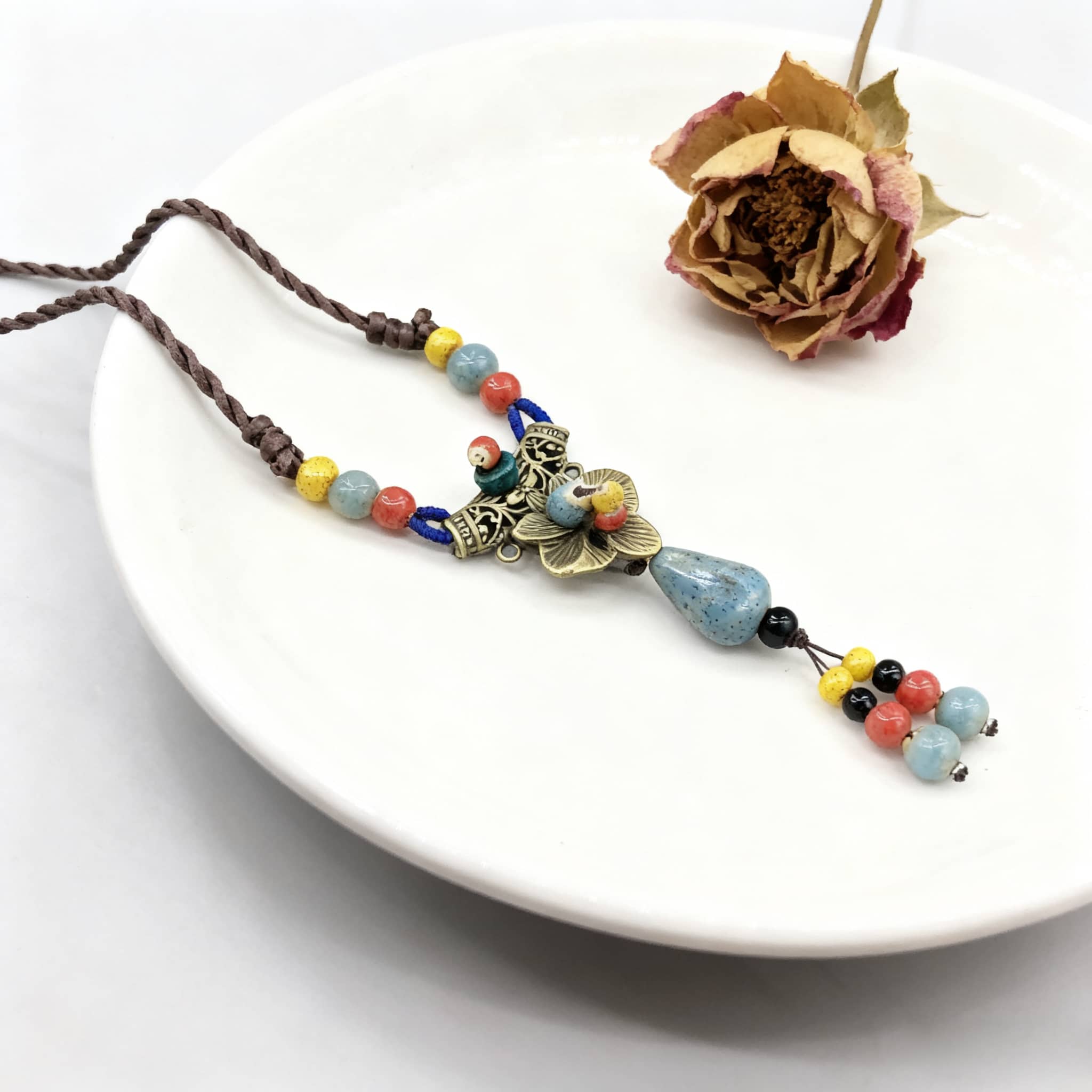 Linen ceramic vintage metal necklace with colorful beads and a floral design accent