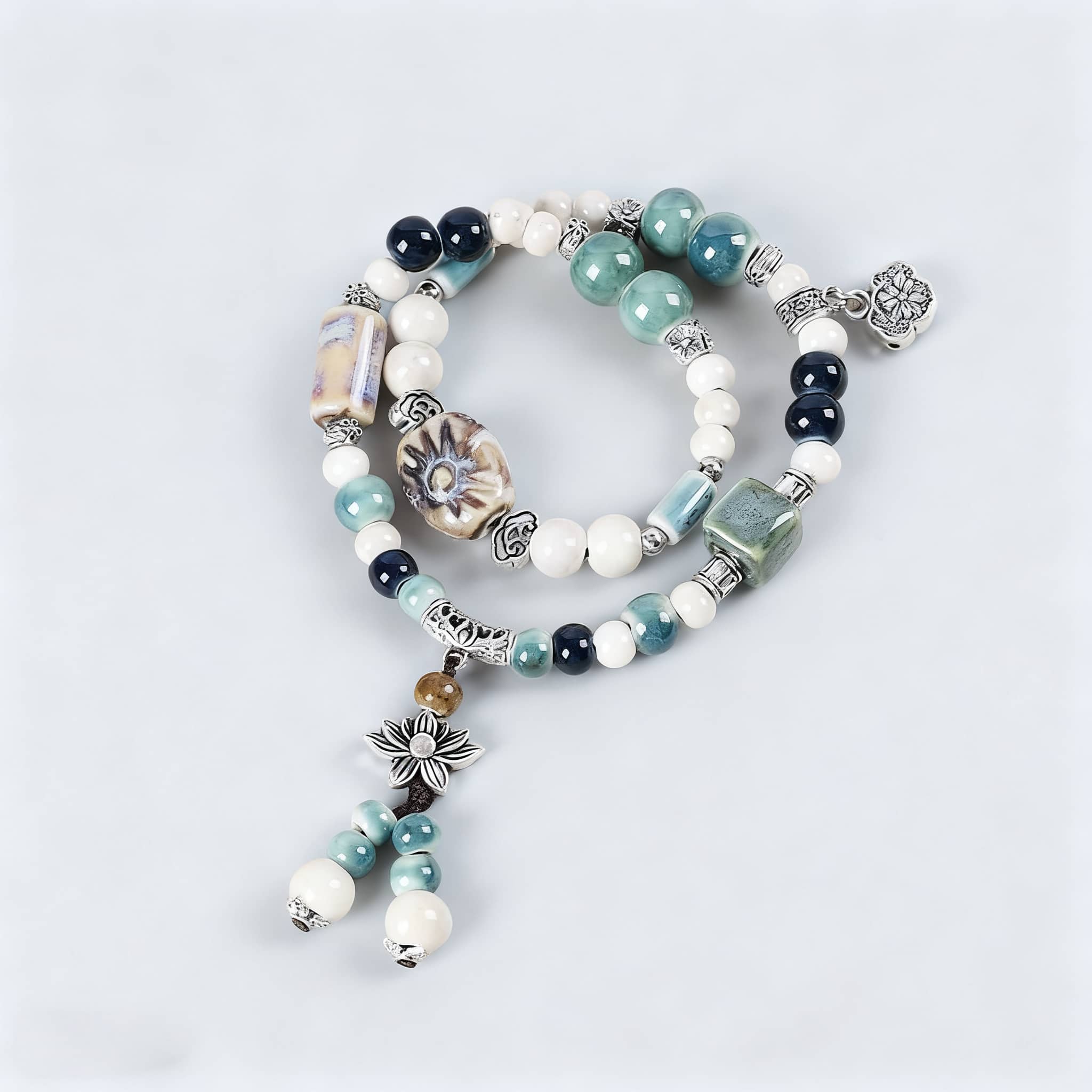 Lotus ceramic bead bracelet featuring intricate designs and a mix of colorful beads
