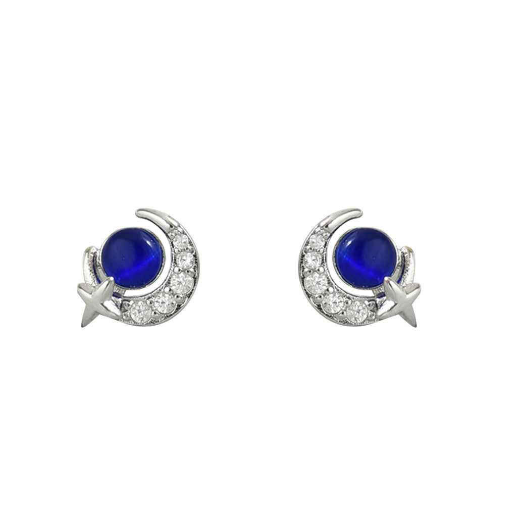 Pair of silver crescent moon star stud earrings with deep blue cabochon center and pave crystals