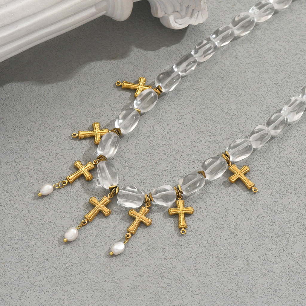 gold cross pearl necklace with clear faceted beads and dangling gold crosses and small freshwater pearls