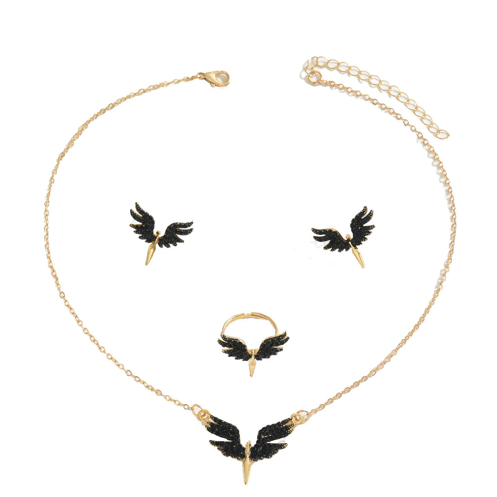 Gold necklace ring and stud earrings featuring black wing accents and spike pendant black angel wings jewelry set