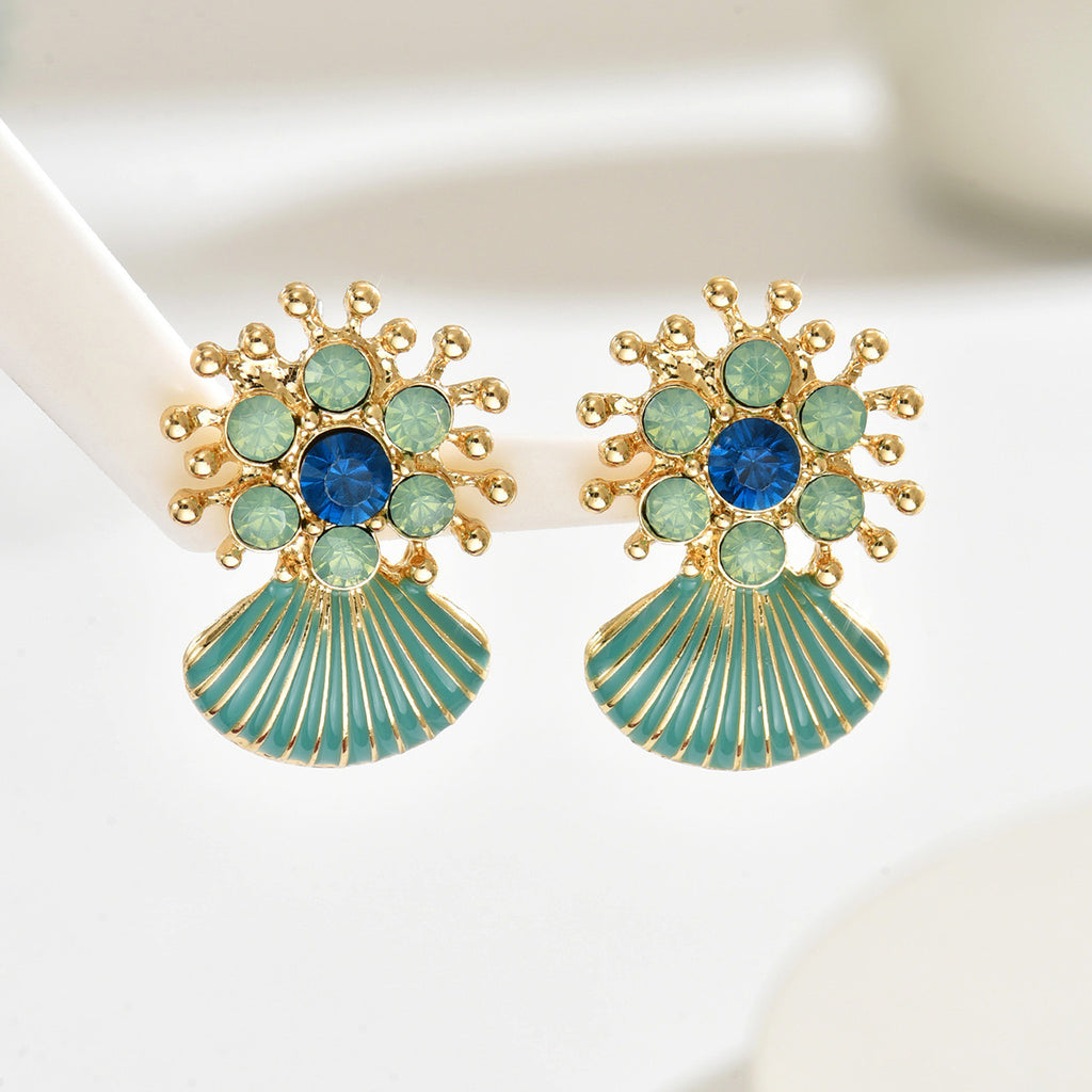 Gold sunburst earrings with blue center gems and ribbed enamel scallop shells geometric green shell drop earrings