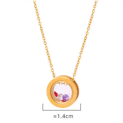 Gold necklace with circular pendant containing colorful stones, meaningful jewelry for anxiety