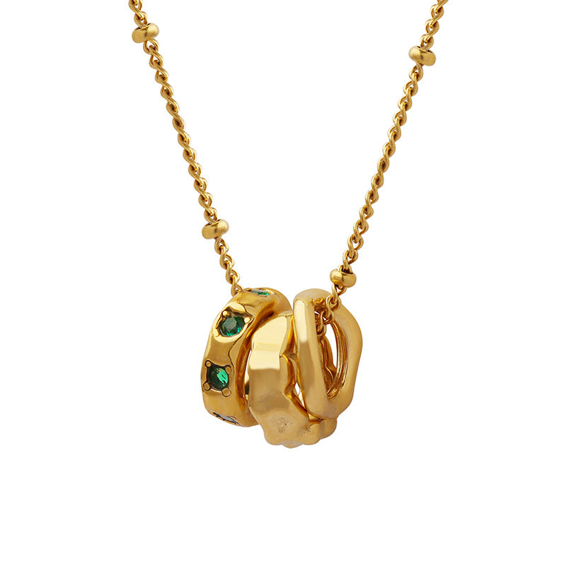 Gold insecure necklace with green gemstone accents meaningful jewelry for anxiety