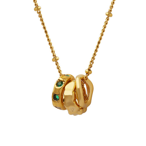 Gold insecure necklace with green gemstone accents meaningful jewelry for anxiety