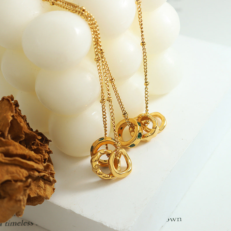 Gold layered necklace set featuring circular pendants as meaningful jewelry for anxiety