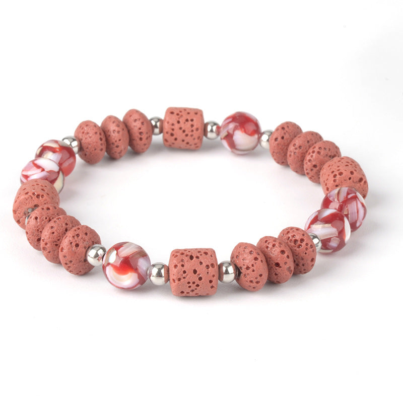 Mens healing lava rock bracelet featuring red porous lava beads and marbled round accent beads