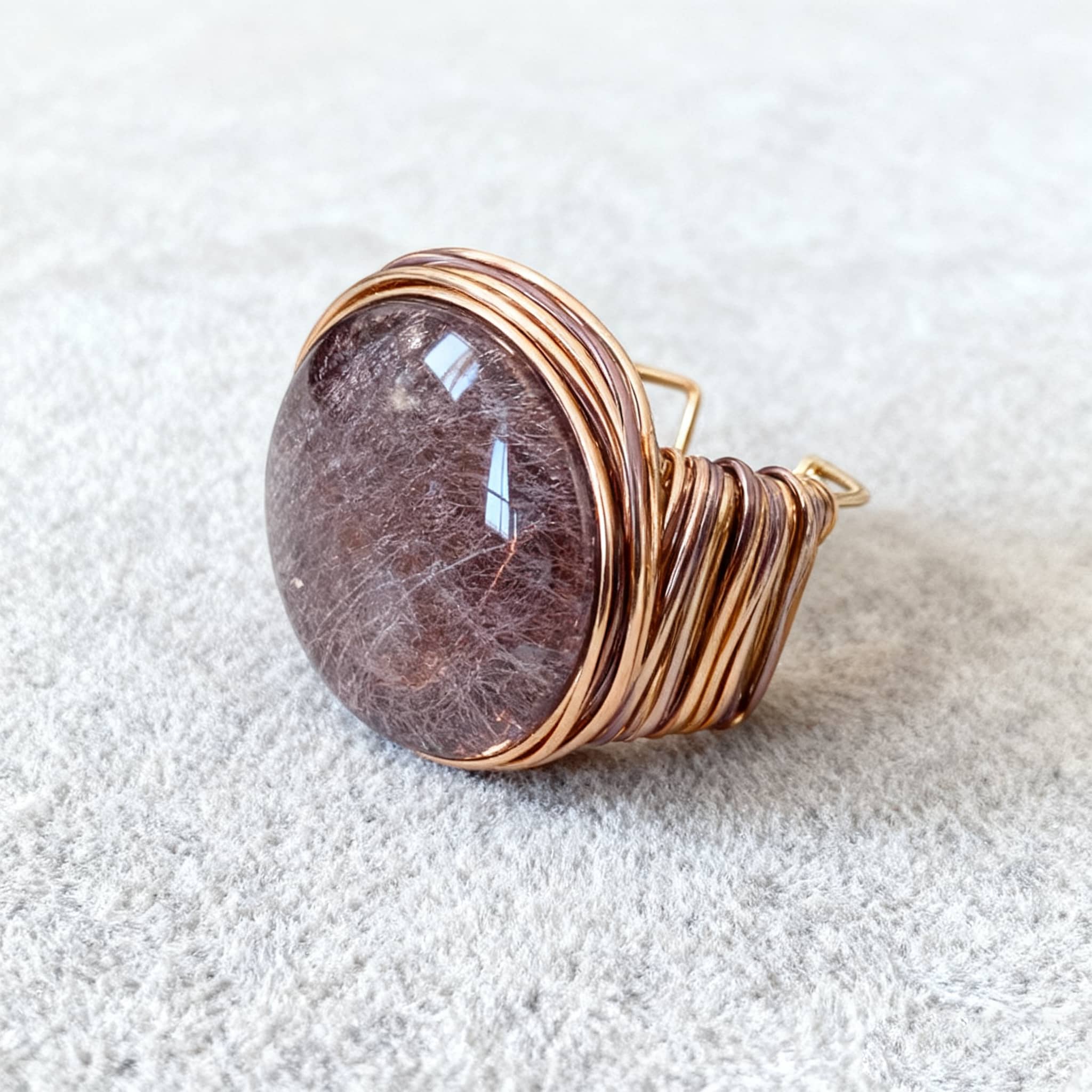 Elegant mindful resin cuff bracelet with a striking circular stone and gold wire detailing