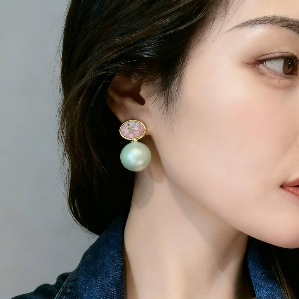 Mint pearl ceramic earrings from 5 Senses featuring a shimmering mint pearl and floral design