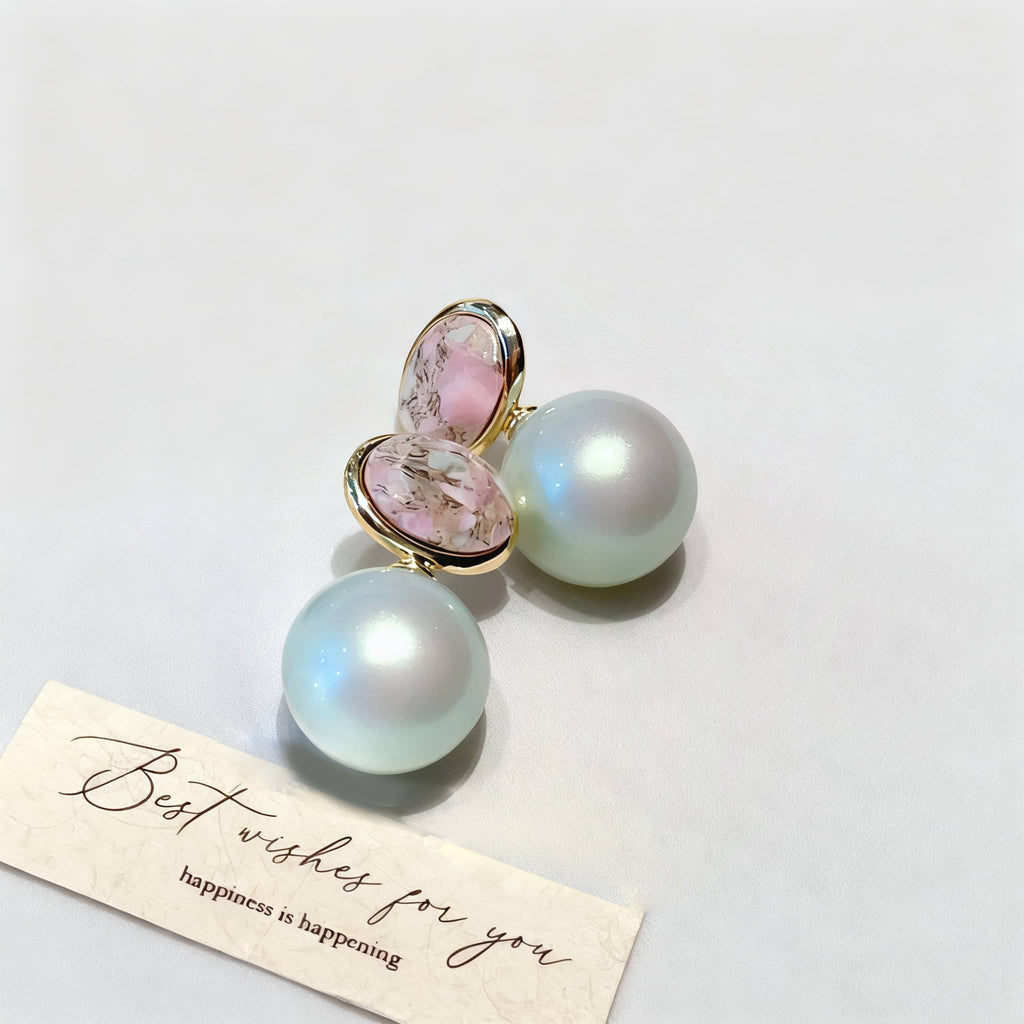 Mint pearl ceramic earrings featuring a glossy finish and elegant design with a pink accent