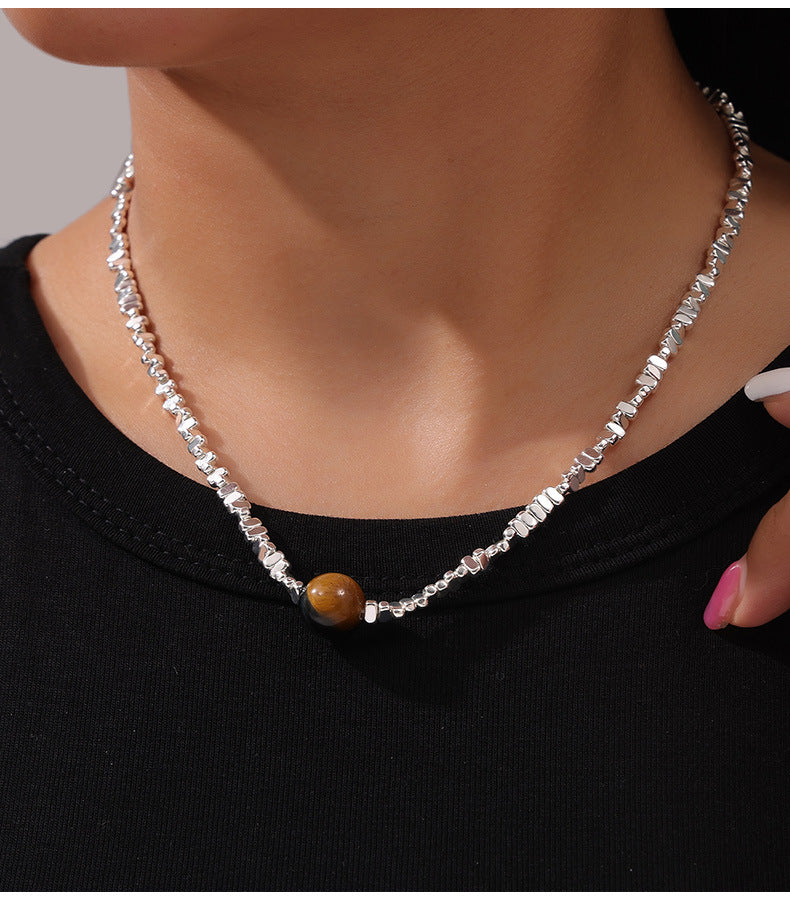 Anxious healing crystal necklace silver chain with a brown round bead worn on neck