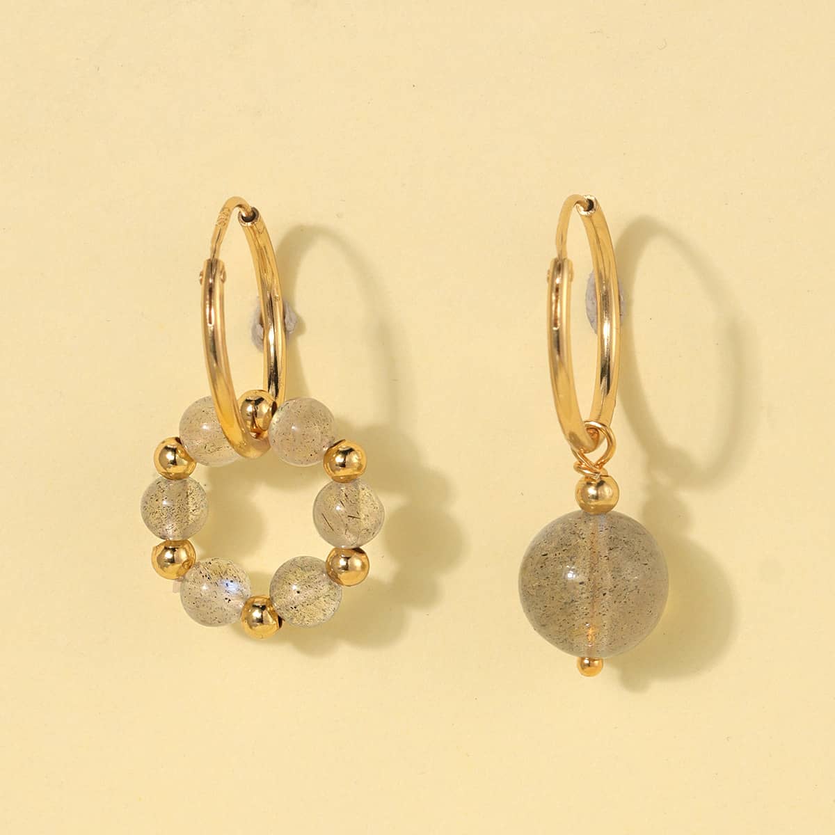 Elegant moonstone anxiety earrings with gold accents and textured beads for calming energy