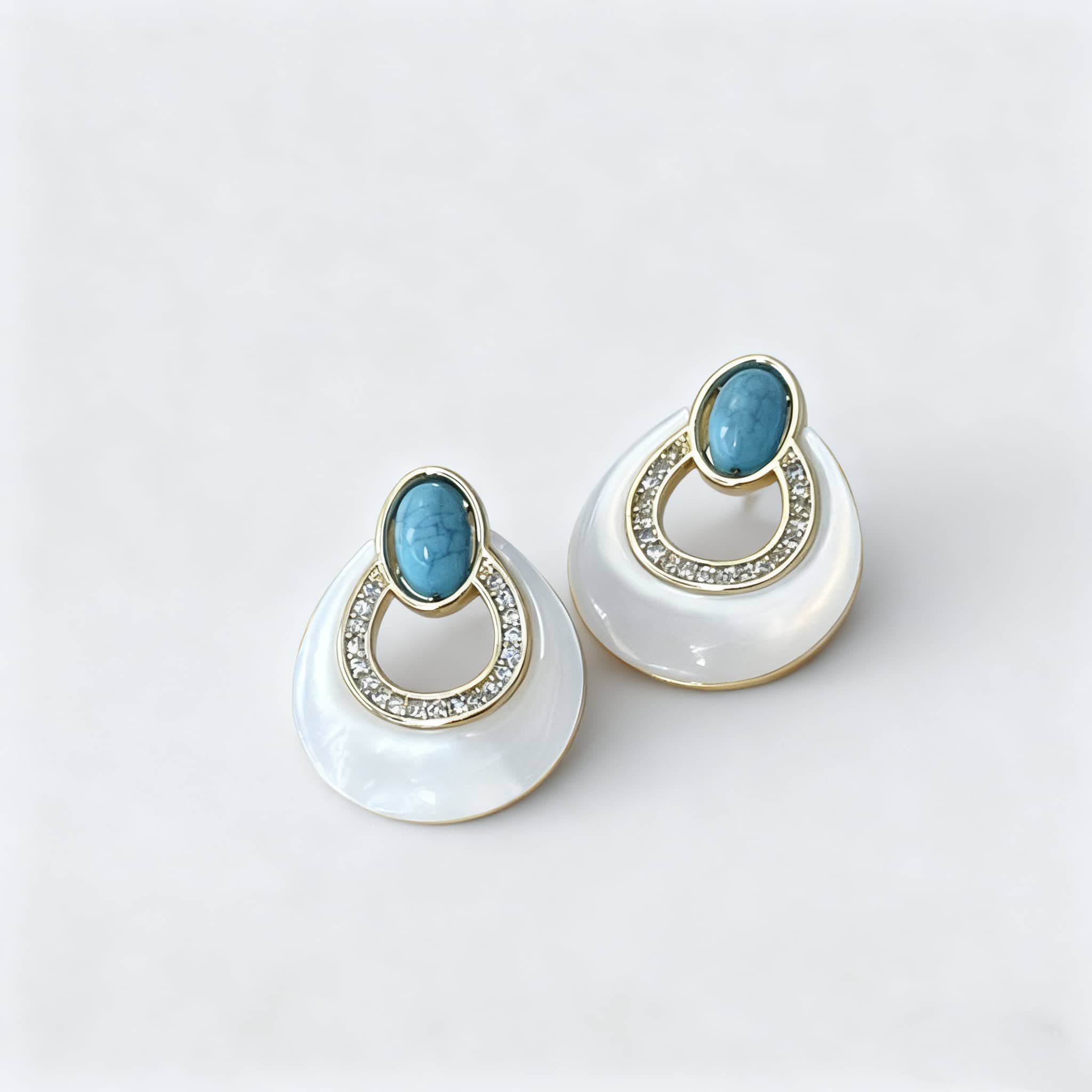 Elegant mother-of-pearl and blue turquoise earrings with sparkling accents, perfect for any occasion