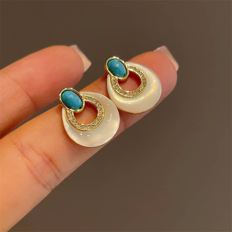 Elegant mother-of-pearl and blue turquoise earrings featuring a unique design for stylish wear