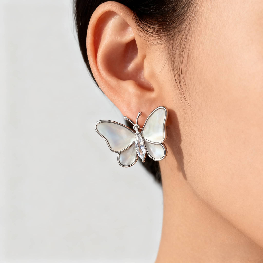 Elegant mother of pearl butterfly earrings with a shiny crystal accent for a sophisticated look