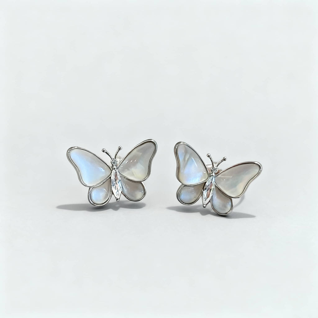 Insecure mother of pearl butterfly earrings featuring intricate floral designs with natural stones
