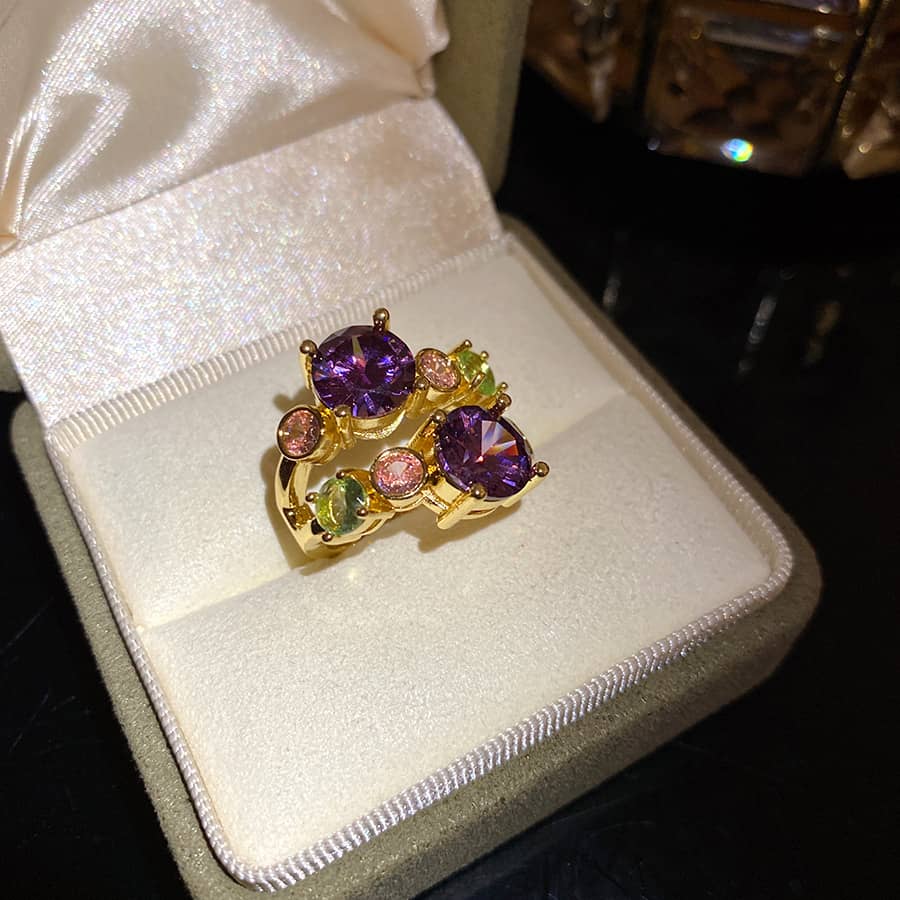 Elegant gold Joy multi-zircon open ring featuring colorful gemstones in purple, green, and pink
