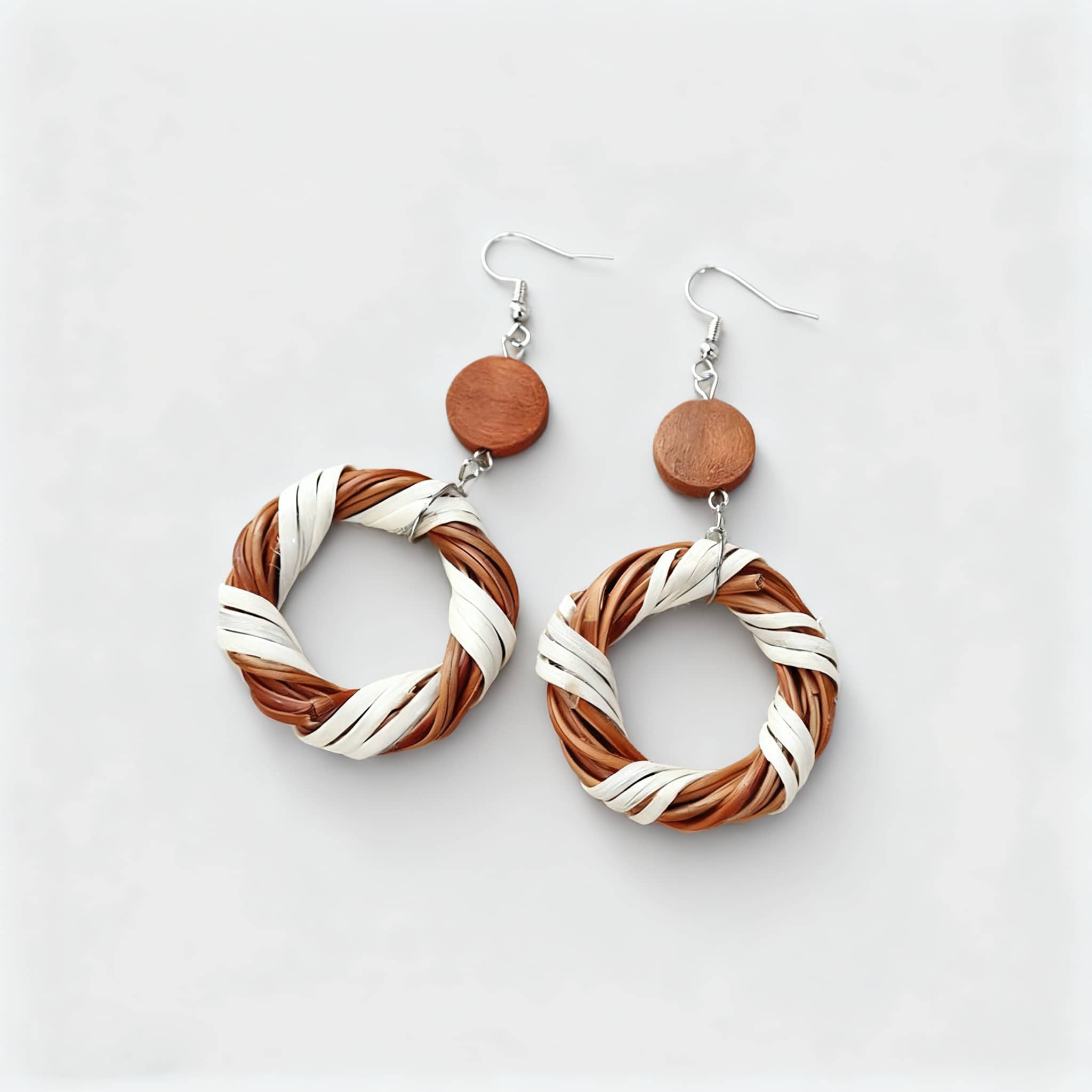 Natural bamboo circle earrings featuring a woven design with brown and white accents