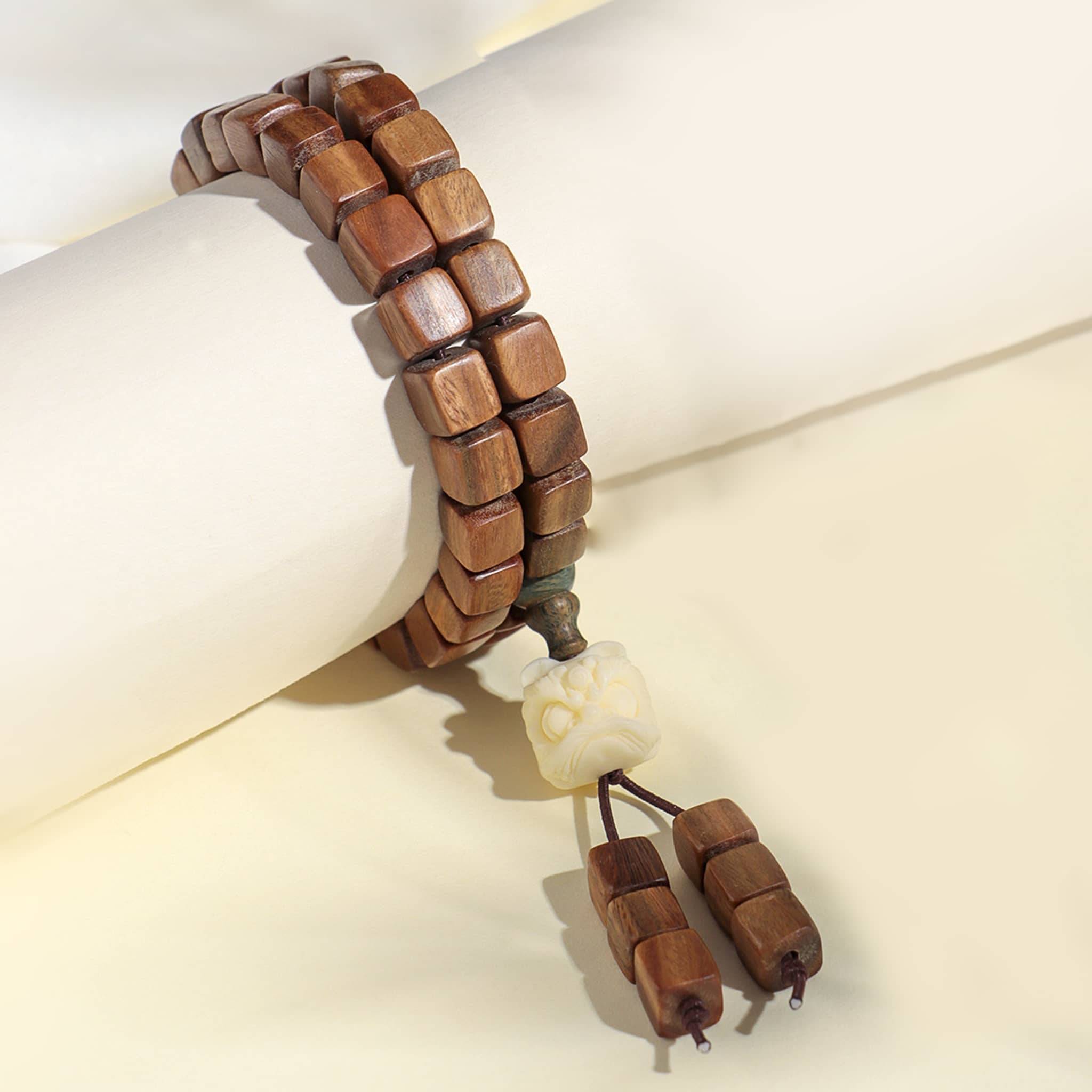 Natural green sandalwood bracelet with square beads and decorative tassel for relaxation and style