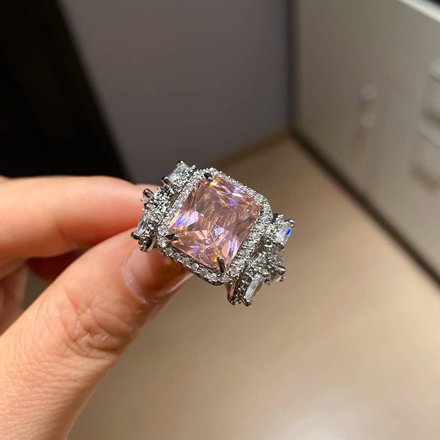 Elegant pink zircon silver ring with intricate detailing and sparkling accents